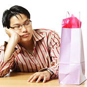 Sad guy goes shopping to feel better. 