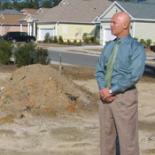 Gary Drejza stands at his empty lot 