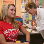 student getting vaccination at health center 
