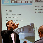 An auctioneer's assistant at a foreclosure auction 