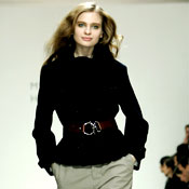 Model walks down runway 