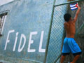 A Cuban child holding a national flag