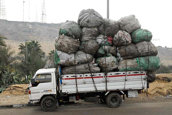 
                Cairo is a city of 8 million people, and yet most of the city's garbage is collected by an unofficial labor force which has been acting of its own volition for nearly 100 years. The "Zabbaleen," or "Trash People," live at the foot of the Muqqattam Hills on the city's east side. They collect, sort, sell, recycle, and reuse the vast majority of Cairo's refuse.
                                    (Alexander Heilner)
                                