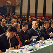 Business leaders and politicians at a conference 