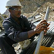 A worker for Centamin of Egypt takes core samples from Red Sea hills area where gold mining is planned.