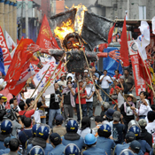 Protesters burn an effigy of Philippine President 