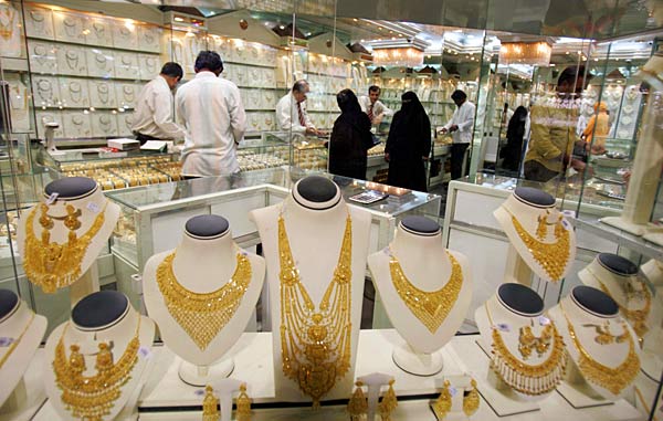 
                Customers shop from a store at the gold market in Dubai, one of the busiest jewelery markets in the Middle East.
                                    (Karim Sahib/AFP/Getty Images)
                                