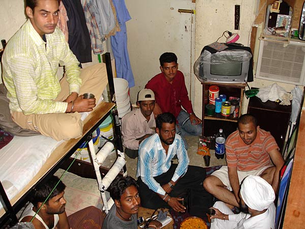 
                Migrant workers in a room they share in the Sonapour labor camp outside Dubai.
                                    (Stephen Beard)
                                