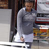 Janel Knight primes baseboards in St. Bernard, La.