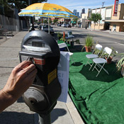 Feeding a parking meter in Los Angeles 