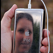 A woman listens to an iPod 