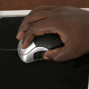 Close-up of a hand moving a mouse 