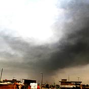 Smoke from exploded oil pipeline near Basra, Iraq 