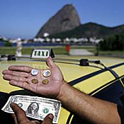 Taxi driver display Brazil, U.S. currency 