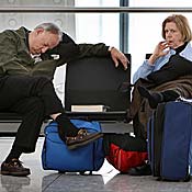 A passenger sleeps at Heathrow's Terminal 5 