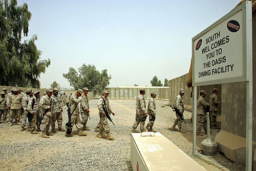 
                    Many soldiers find life within the walls of Camp Anaconda, a huge U.S. Army base northwest of Baghdad, strangely similar to life back home.
                                            (Liu Jin/AFP/Getty Images)
                                        