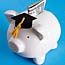 Piggy bank in cap and gown