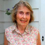 Ruth Fallon, standing on the porch of the Massachusetts home where she lived for most of her 85 years.