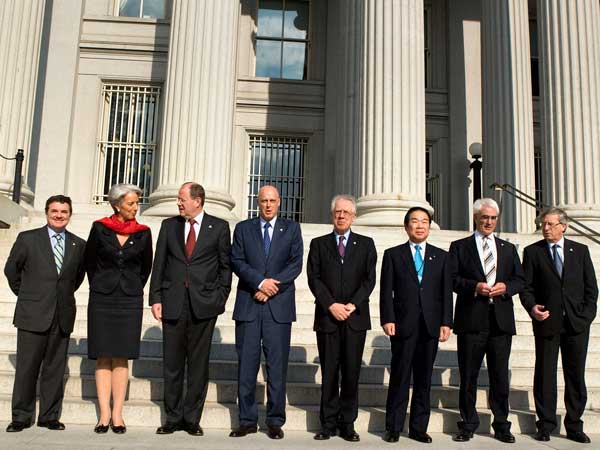 
                G-7 finance ministers pose outside the U.S. Treasury in Washington, D.C. They are, from left, James Flaherty of Canada, Christine Lagarde of France, Peer Steinbruck of Germany, Henry Paulson of the United States, Tommaso Padoa-Schioppa of Italy, Fukushiro Nukaga of Japan, Alistair Darling of the United Kingdom, and Jean-Claude Juncker of the Eurogroup.
                                    (Brendan Smialowski/Getty Images)
                                