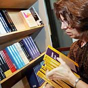 June Kapitan stocks textbooks in Boston store. 