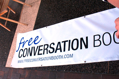 
                    Andrew Simmons unfurls a sign donated to his "cause" by the Santa Cruz, Calif.,-based Catto's Graphics. It replaces his original hand-lettered sign.
                                            (Ekene Okobi)
                                        