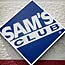 A sign on the front of a Sam's Club store.