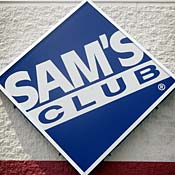 A sign on the front of a Sam's Club store. 