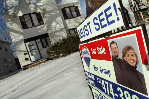
                    A sale sign sits in front of a home in the Shaker Heights section of Cleveland, Ohio. Cleveland is the epicenter of the nation's foreclosure crisis -- bad news for nearby homeowners and cities nationwide, because they lead to falling property values and increased crime.
                                            (Timothy A. Clary)
                                        