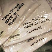 Shirts made in China on store shelf 
