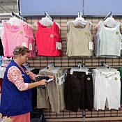 Wal-Mart employee scans clothing items 