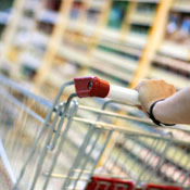 person pushing shopping cart 