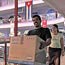 Cuban man carries his new computer