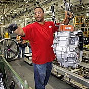 Ford plant employee with transmission 