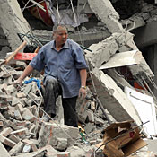 Rescuers searching through rubble 