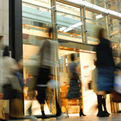Shoppers walking by stores 