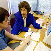 A financial planner helps a client review her fina 