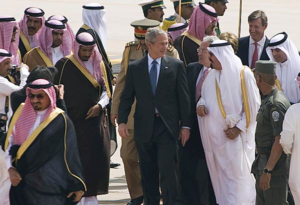 
                President Bush speaks with Saudi King Abdullah after walking off Air Force One during the arrival ceremony at King Khaled International Airport in Riyadh on May 16, 2008.
                                    (Jim Watson/AFP/Getty Images)
                                