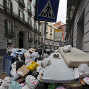 Trash collects in the streets of Naples 