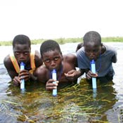 Boys drink through Lifestraws 
