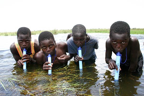 
                Boys drink through Lifestraw water purifiers.
                                    (Courtesy of Vestergaard Frandsen)
                                