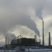 Smoke pours from the smokestacks 