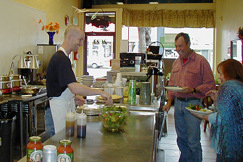 
                    Brad Birky with some happy customers at the SAME Cafe in Denver, Colo.
                                            (Courtesy Brad Birky)
                                        