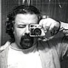 Alexander Thompson self-portrait with film camera