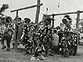 This 1940s-era photo shows Red Lake tribal members celebrating and giving thanks during a traditional powwow. While Ojibwe language has faded, the powwow tradition remains strong.