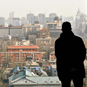 A man overlooking houses in Beijing 