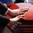 Hands on a casket