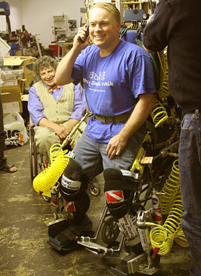 
                    Monty Reed demonstrates lifesuit Prototype 14. Watching him in background is Dr. Steven Stiens.
                                            (Cecelia Lehmann)
                                        