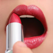 Woman applying lipstick 