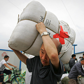 A Chinese earthquake survivor with relief supplies 