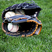 Baseball mitts sitting on the field 